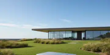 Geothermal home heating system with modern house and green lawn